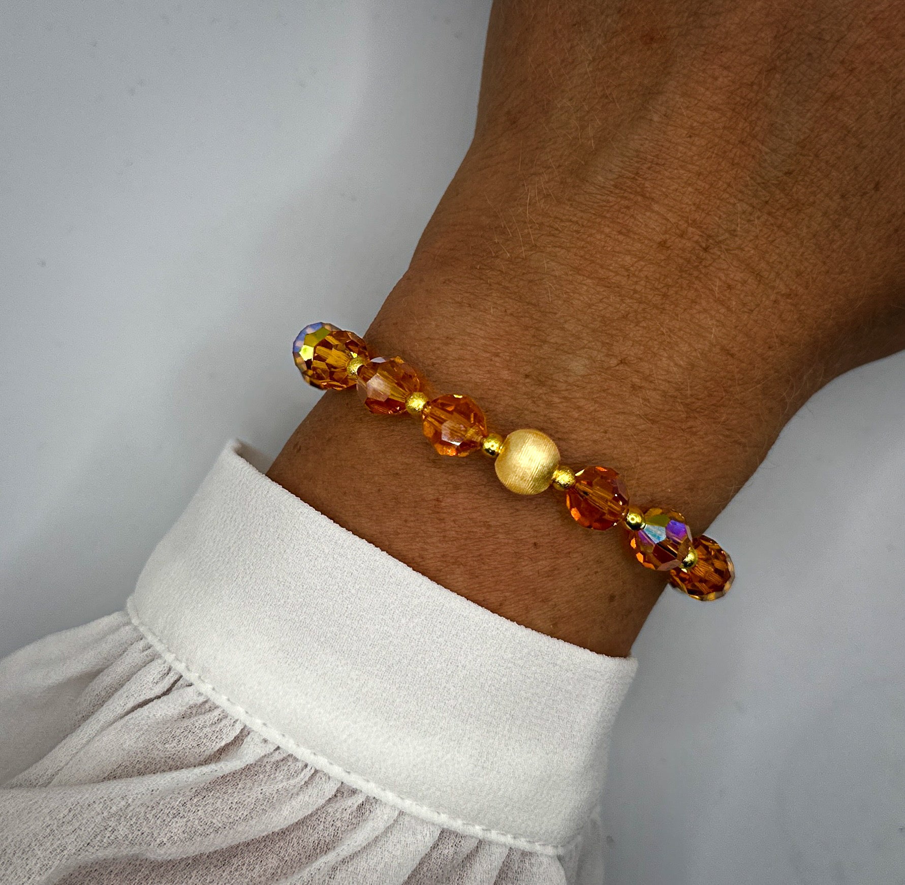 Armband aus Swarovski-Kristallen in orange mit vergoldeter Kugel