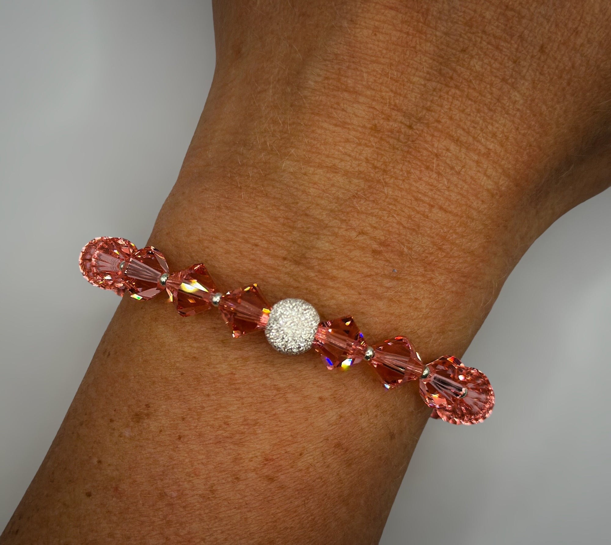 Armband aus rosa Swarovski-Kristallen und diamantierter 925er Sterling-Silberperle