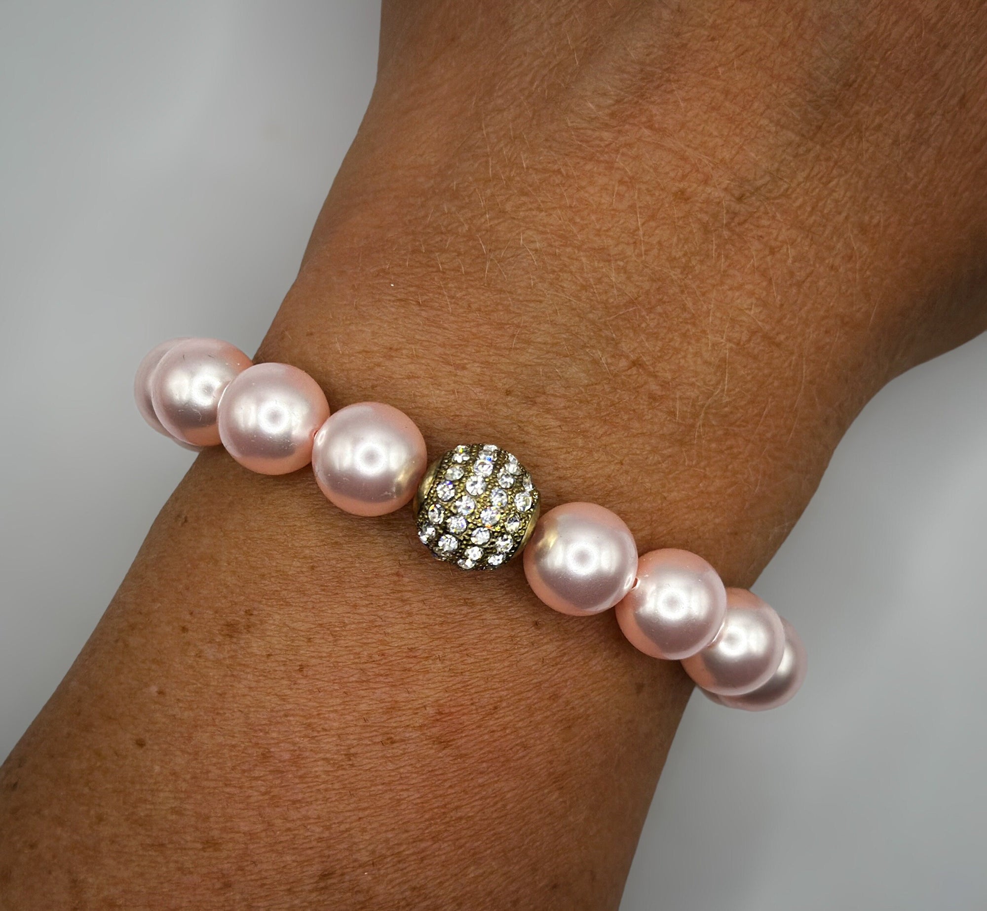 Armband aus rosa Swarovski-Perlen und Strassperle