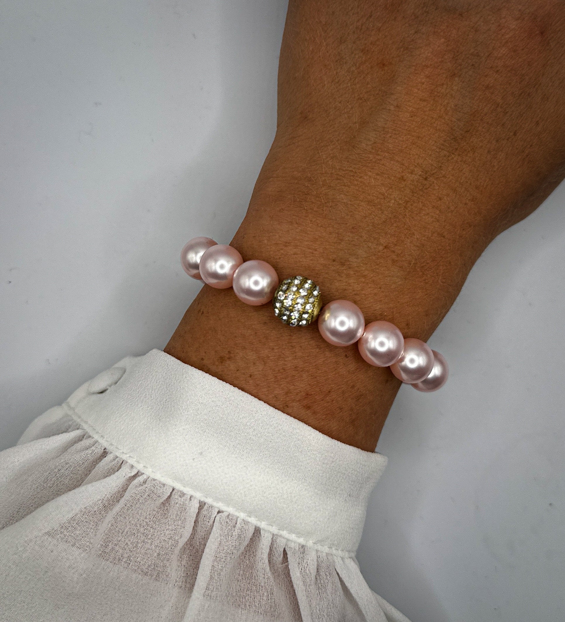 Armband aus rosa Swarovski-Perlen und Strassperle