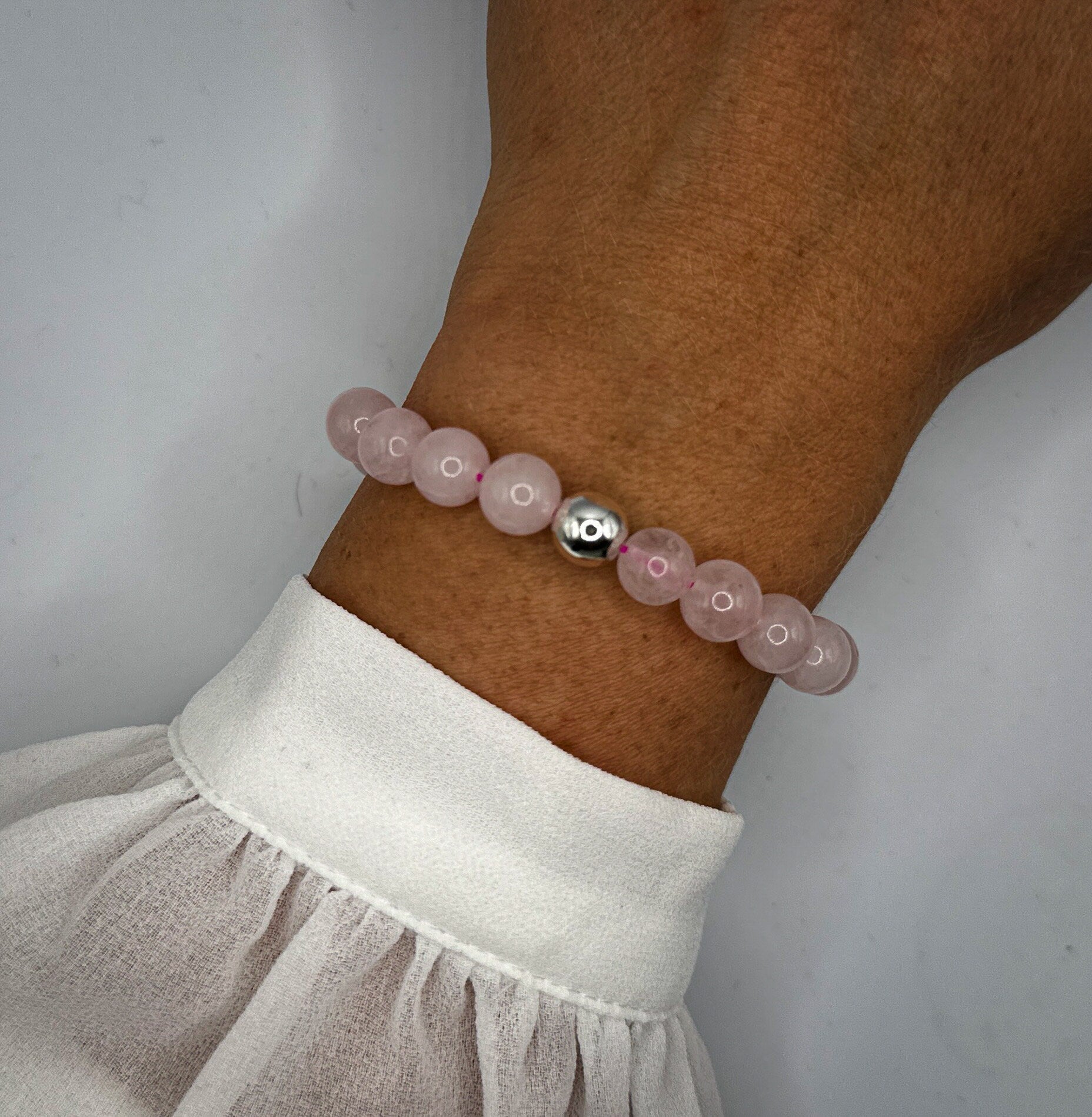 Rosa Armband aus Quarzperlen und Hämatitkugel