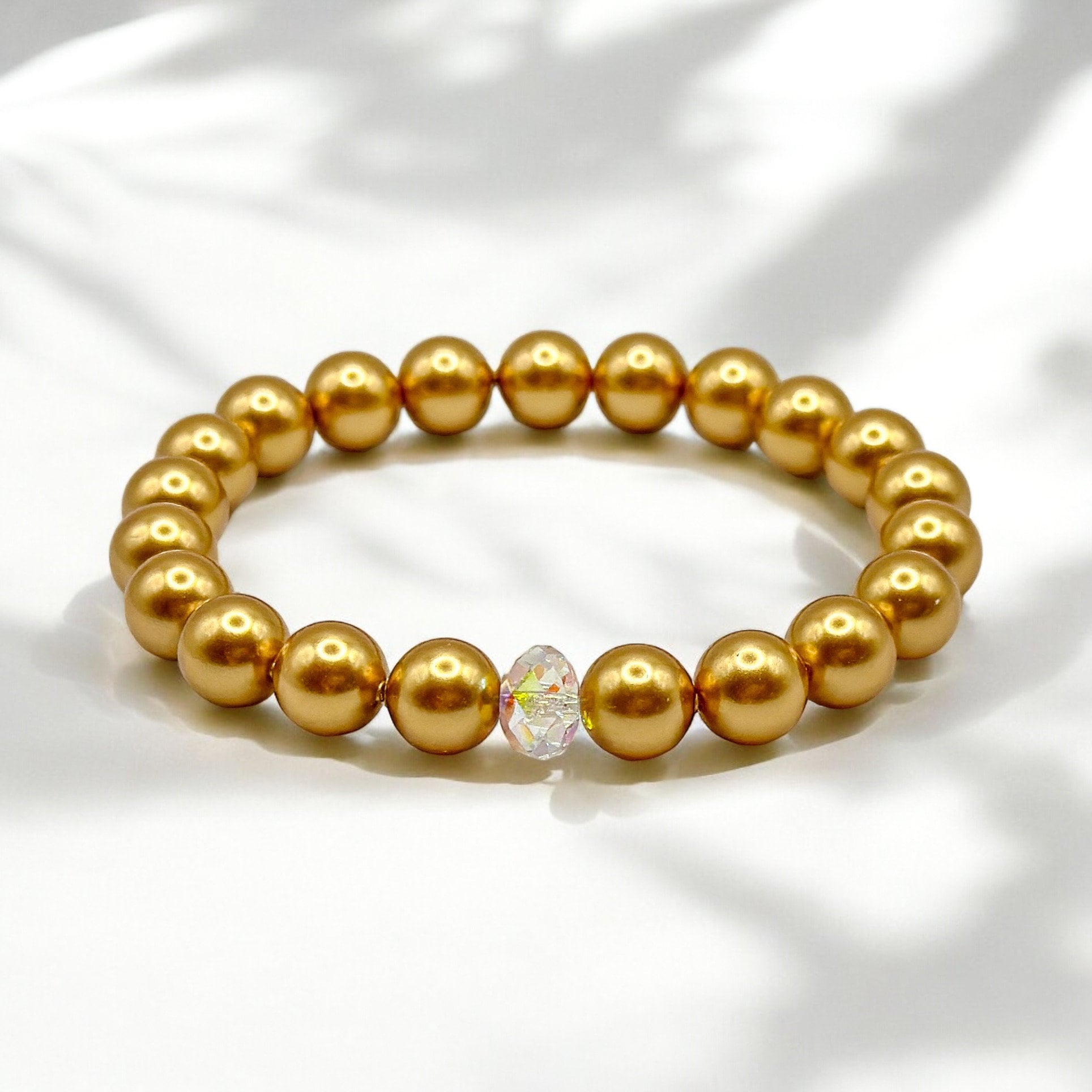 Armband aus goldenen Swarovski-Perlen und Swarovski-Kristall