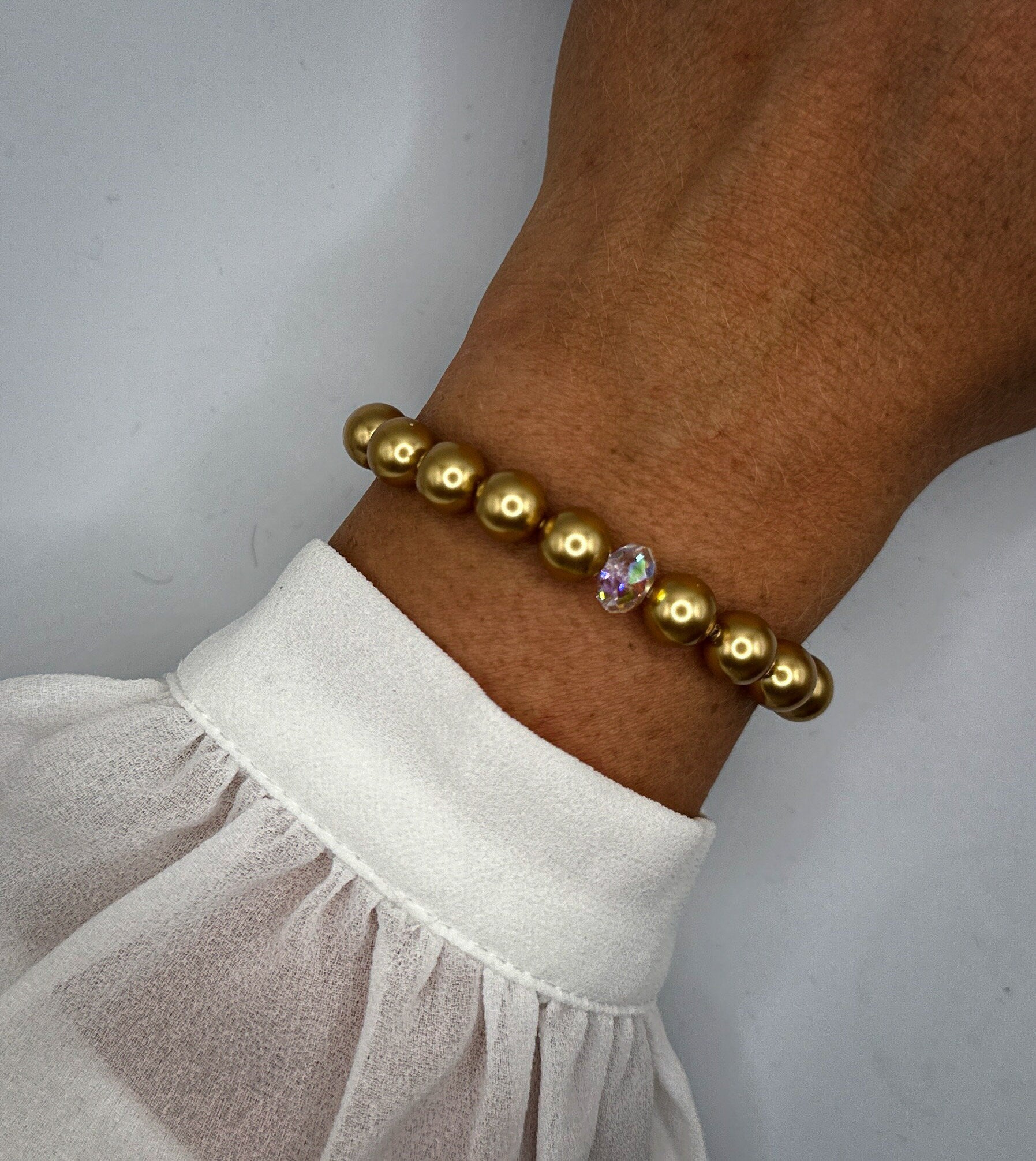 Armband aus goldenen Swarovski-Perlen und Swarovski-Kristall